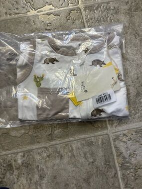 Kyte BABY White Tank Romper with Taupe Armadillo & Cactus Print